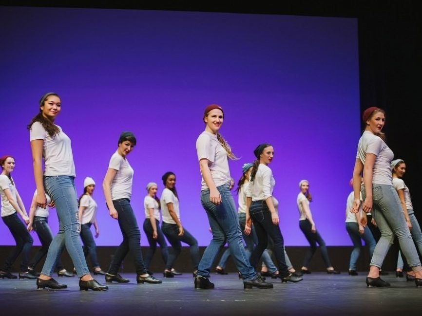 Dance group performing on stage