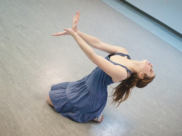 Graceful dance pose in blue dress
