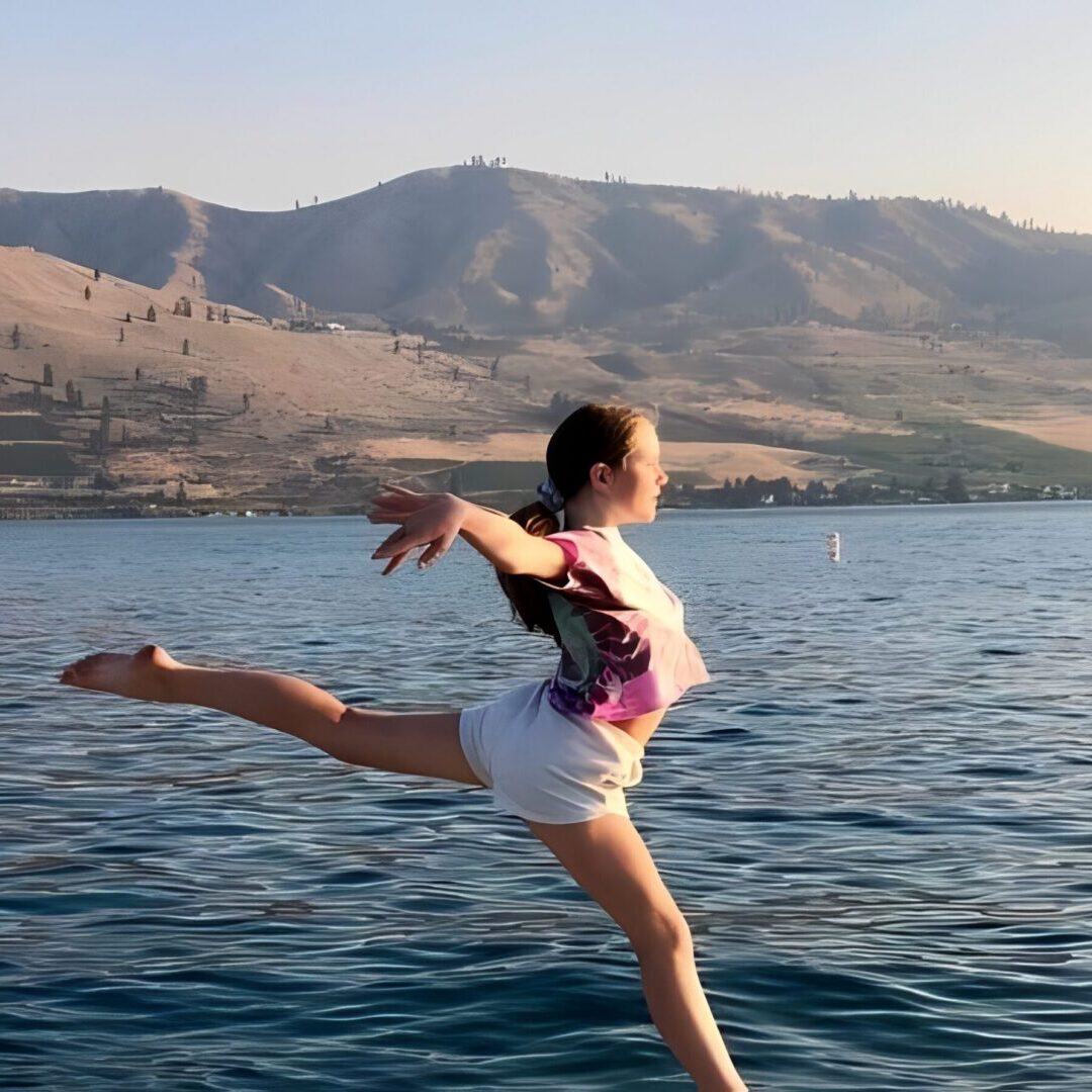 Young girl posing gracefully on water